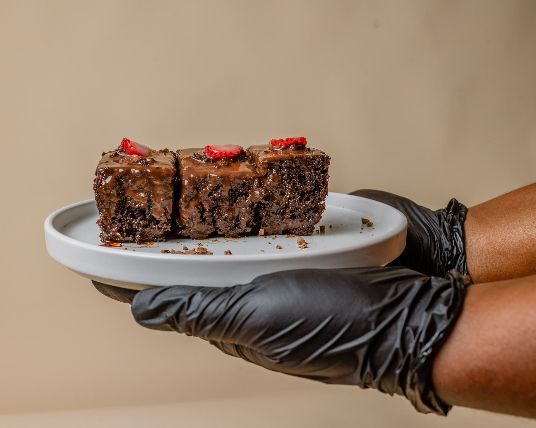 Chef Safoa presenting a brownie